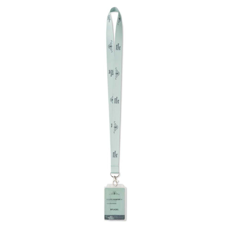 A mint green lanyard with a repeating pattern of the letters 'dr' and a small bird logo, attached to a matching ID badge holder with a clear plastic card slot.