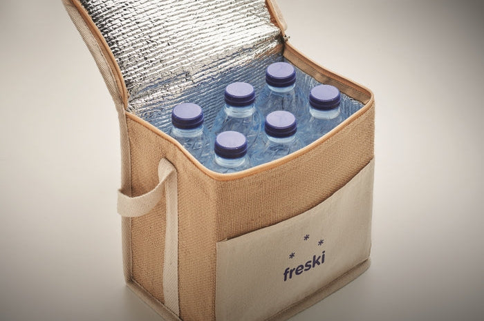 A beige canvas cooler bag with a silver reflective lining, shown open and filled with six water bottles. The front pocket has the brand name 'freski' printed on it.