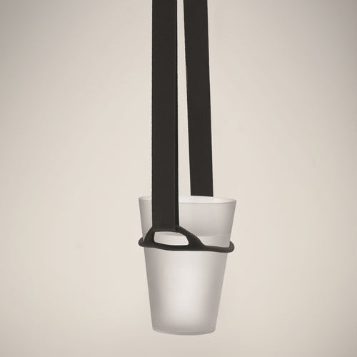 A minimalist pendant light with a frosted white cup-shaped shade and a black hanging strap, shown against a neutral beige background.