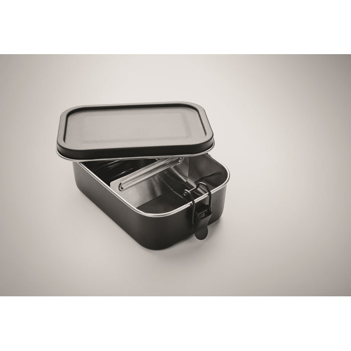 Black rectangular food container with a lid on a gray background