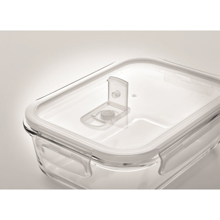 Clear glass food storage container with a transparent lid and integrated handle, photographed on a clean light gray background.