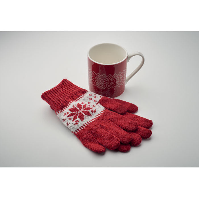 Red knitted Christmas gloves with white festive pattern