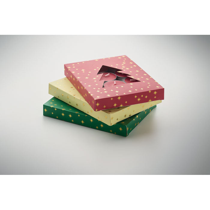 Stacked Christmas gift boxes with tree cutout and gold star design